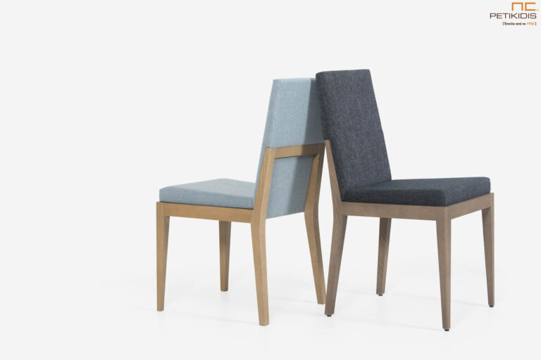 Καρέκλα Renerra με μασίφ ξύλο και ύφασμα αδιάβροχο και αλέκιαστο. Διατίθεται σε μεγάλη ποικιλία χρωμάτων ξύλου και υφασμάτων. Το σχέδιό της είναι ιδανικό για μικρούς χώρους καθώς δεν χρειάζεται αρκετός ελεύθερος χώρος γύρω από το τραπέζι.