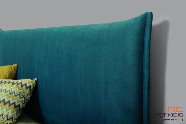 Υφασμάτινο κρεβάτι Tierra της Linea Strom σε ύφασμα μονόχρωμο αλέκιαστο και αδιάβροχο. Το κεφαλάρι έχει ελαφρύ καπιτονέ σχέδιοκαι το ύφασμα αφαιρείται από την βάση και το κεφαλάρι για εύκολο καθάρισμα . Λεπτομέρεια κεφαλαριού.